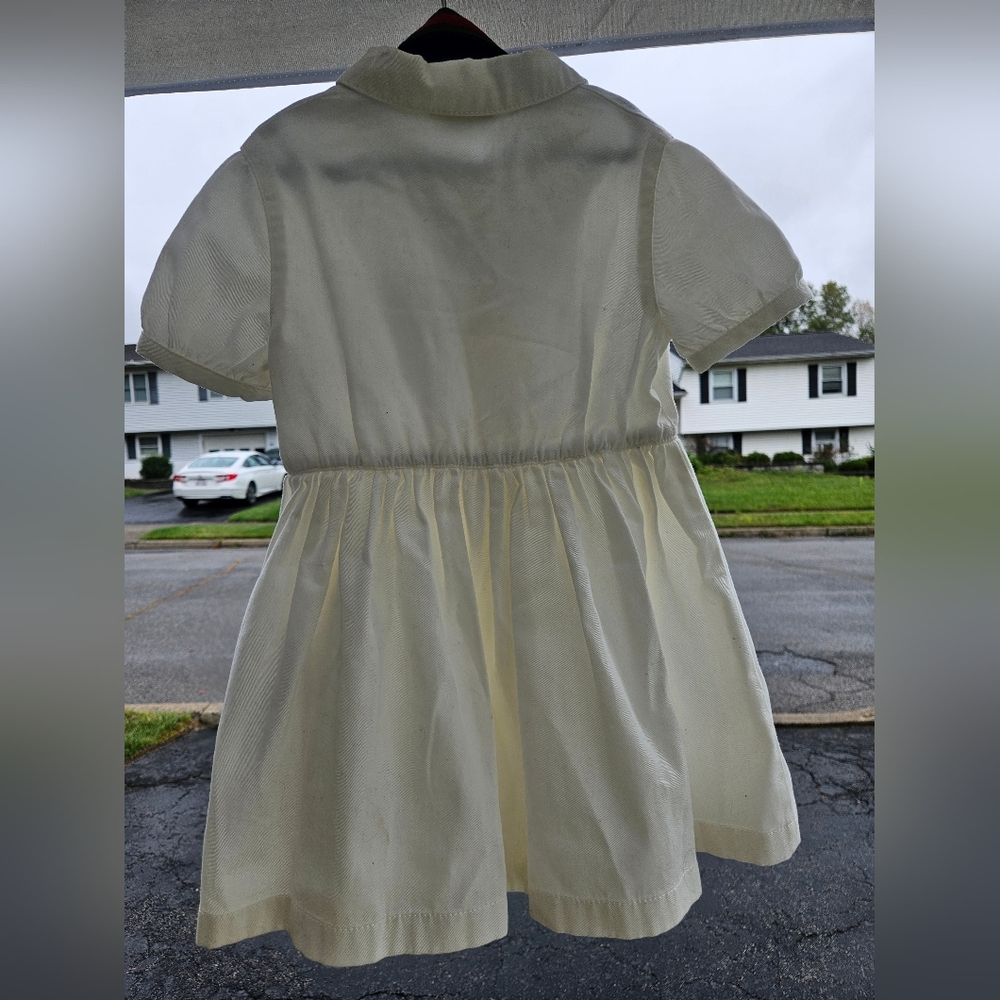 Girls Gucci dress  ..cream colored